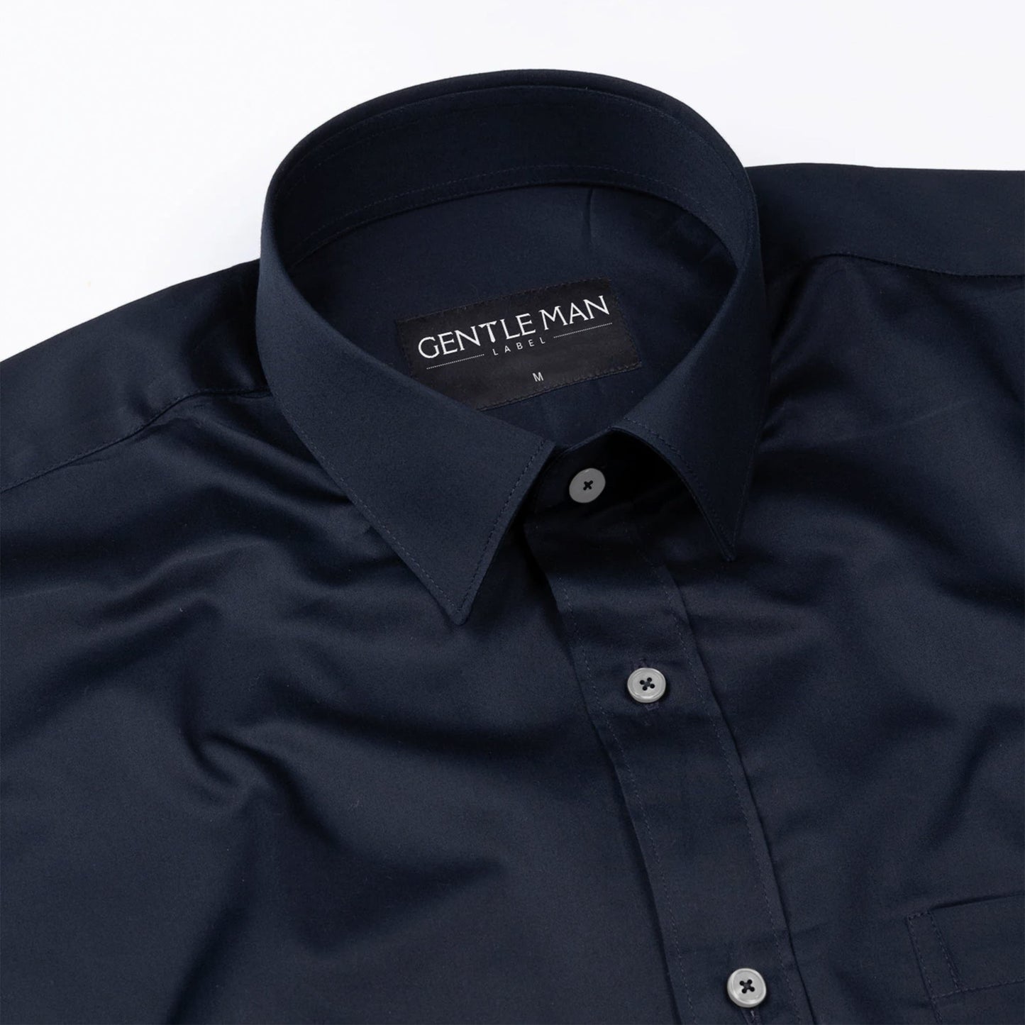 Navy blue shirt with a visible brand label on a white background