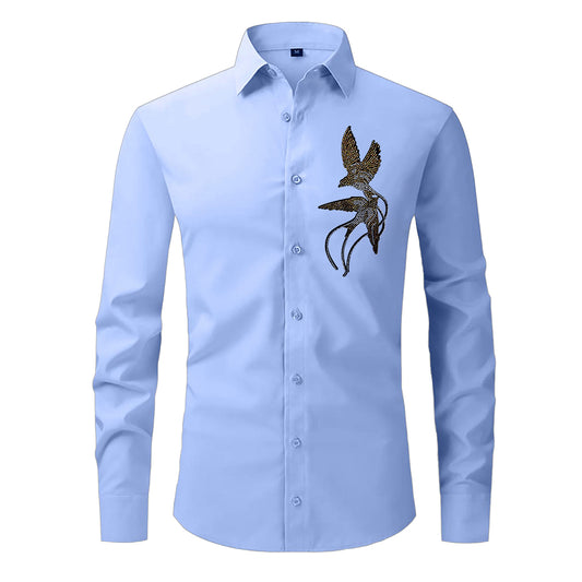 Light blue shirt with a embroidered design on a white background