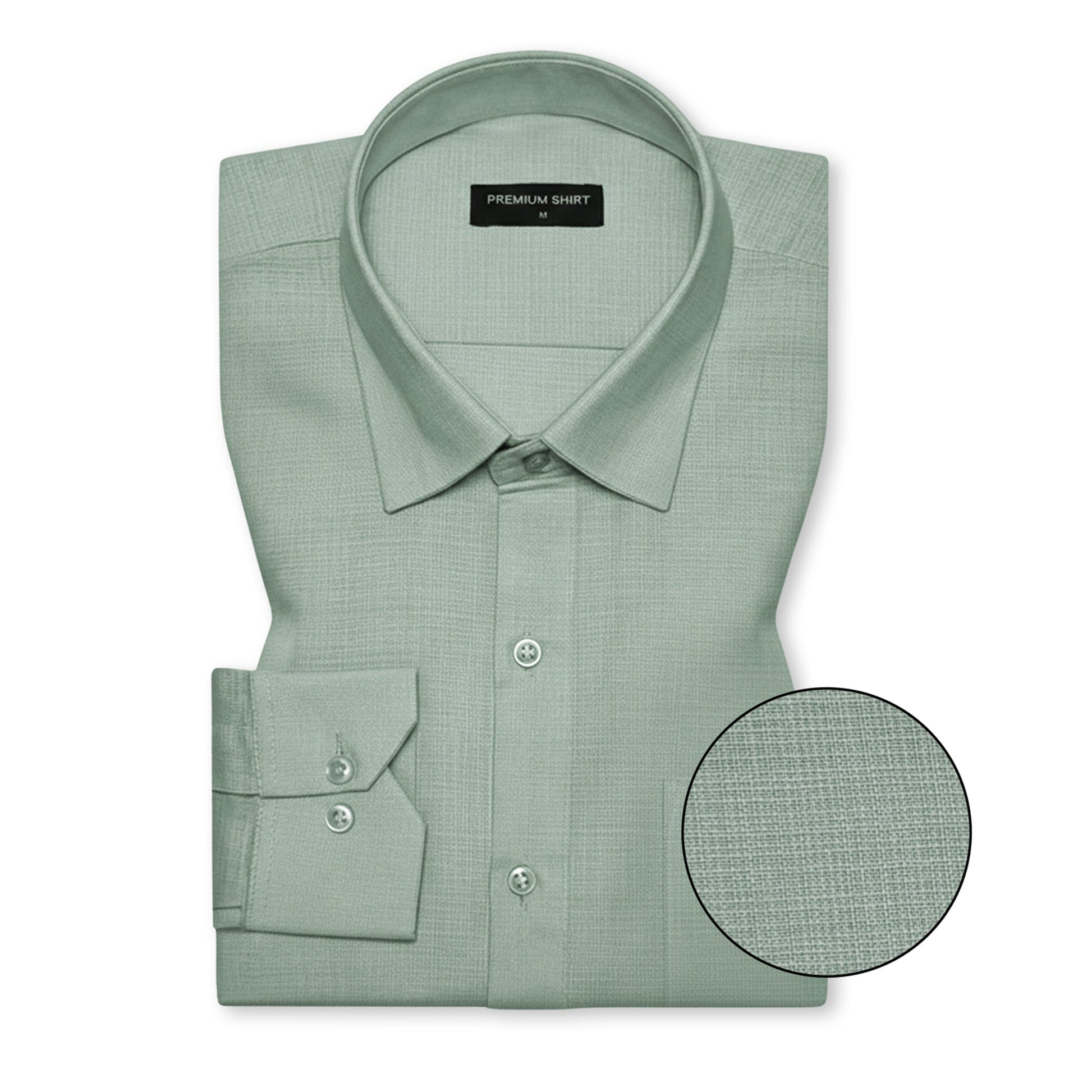 Folded green dress shirt with close-up detail on a white background