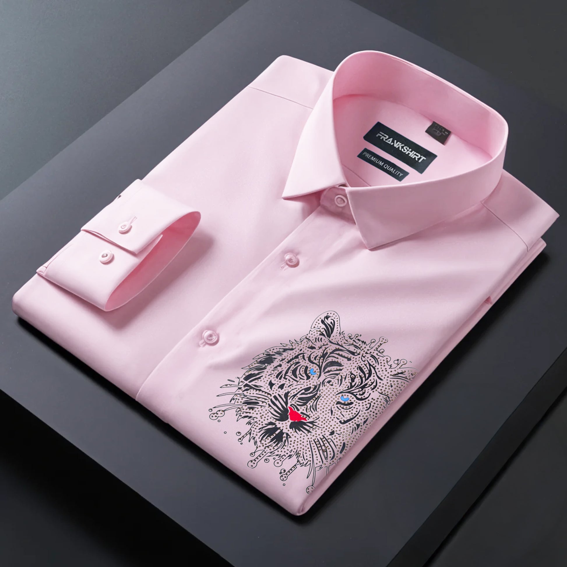 Pink dress shirt with a tiger embroidery on a dark surface