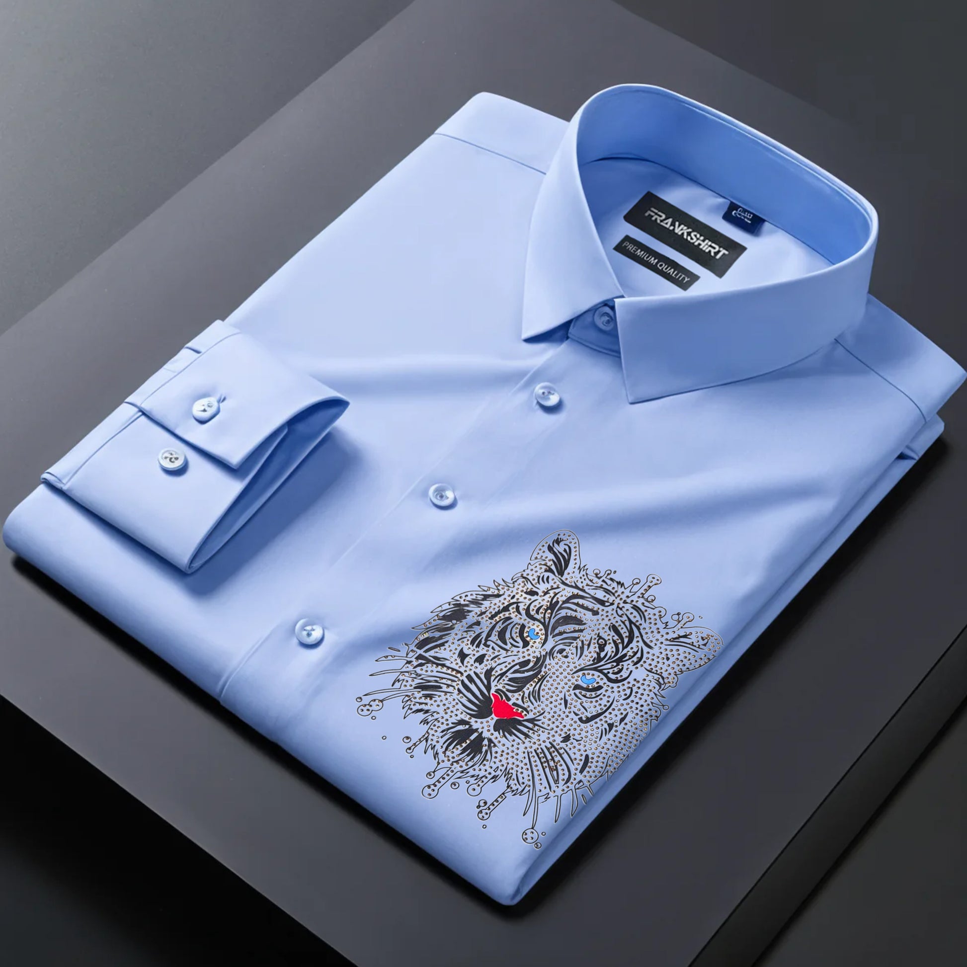 Light blue dress shirt with a tiger emblem on a dark surface