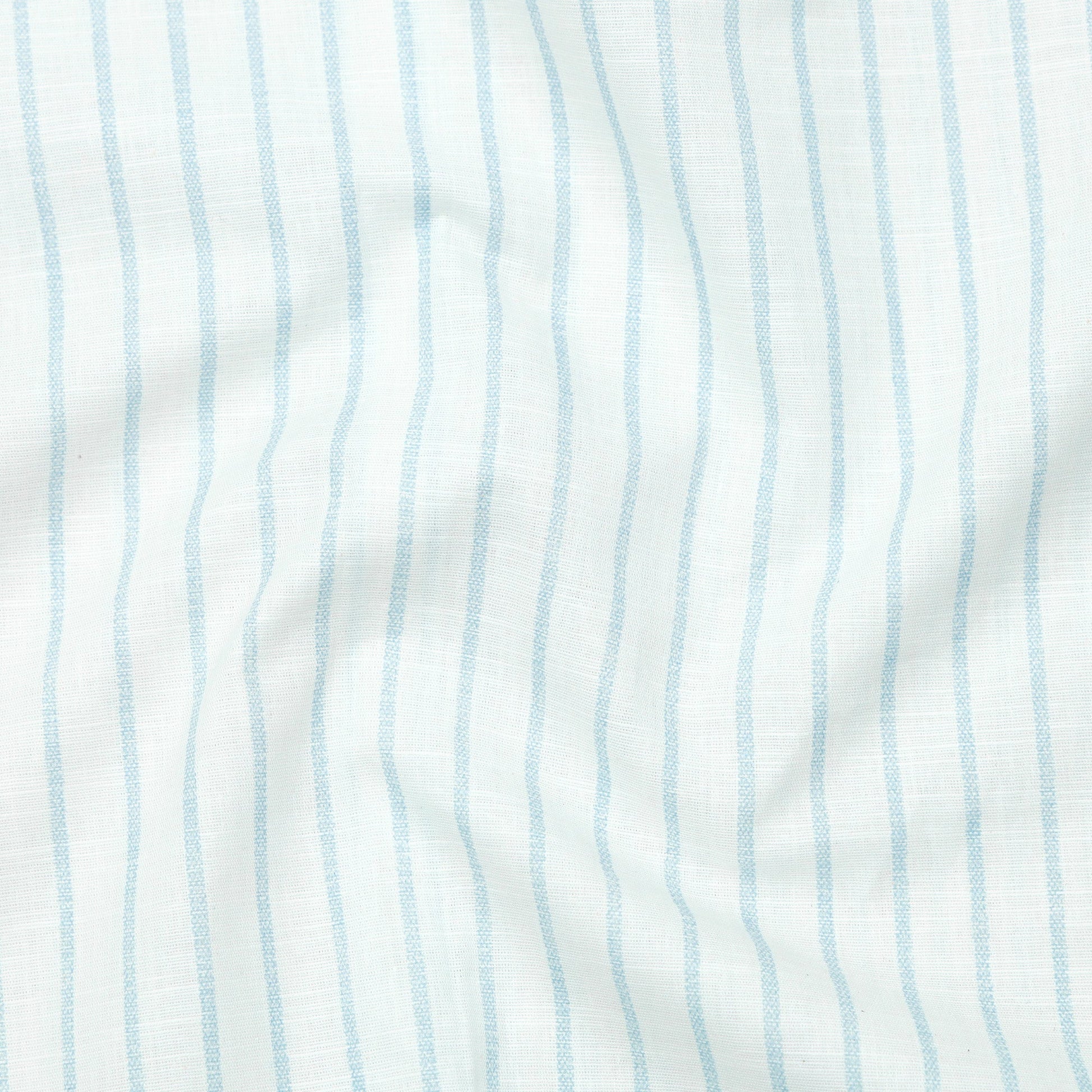 Close-up of fabric with light blue vertical stripes on a white background