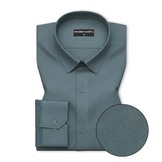 Teal dress shirt with collar and cuff details on a white background