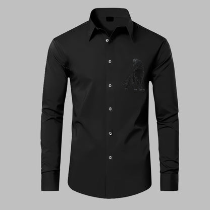 Black dress shirt with a small graphic on a gray background