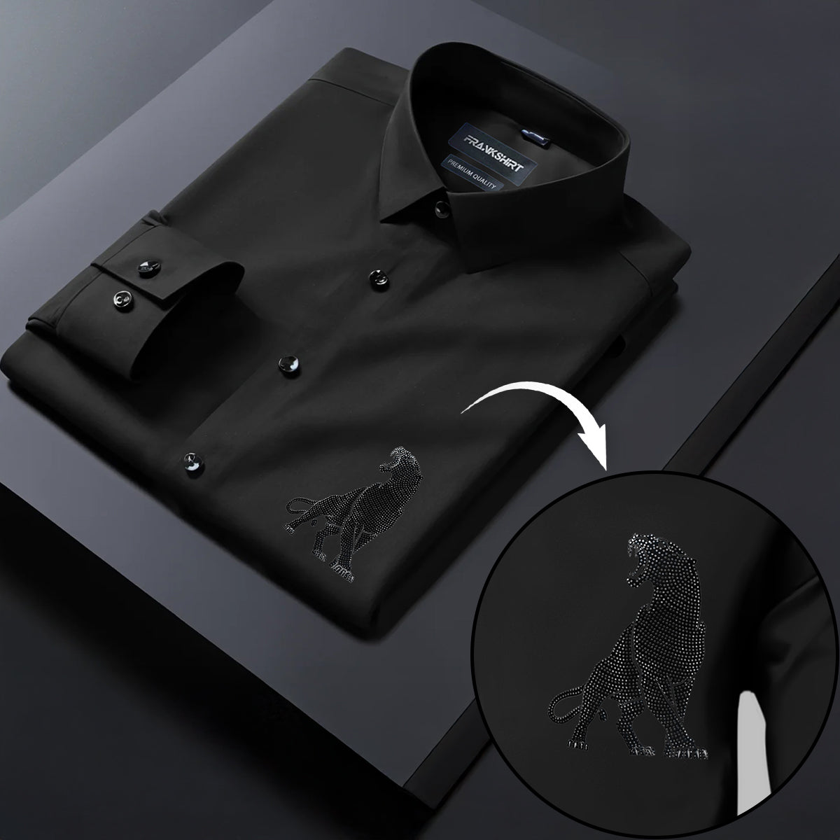 Black dress shirt with embroidered wolf design on a dark background