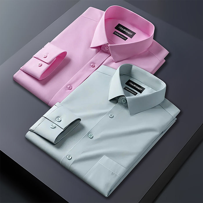 Pink and light blue dress shirts on a dark surface